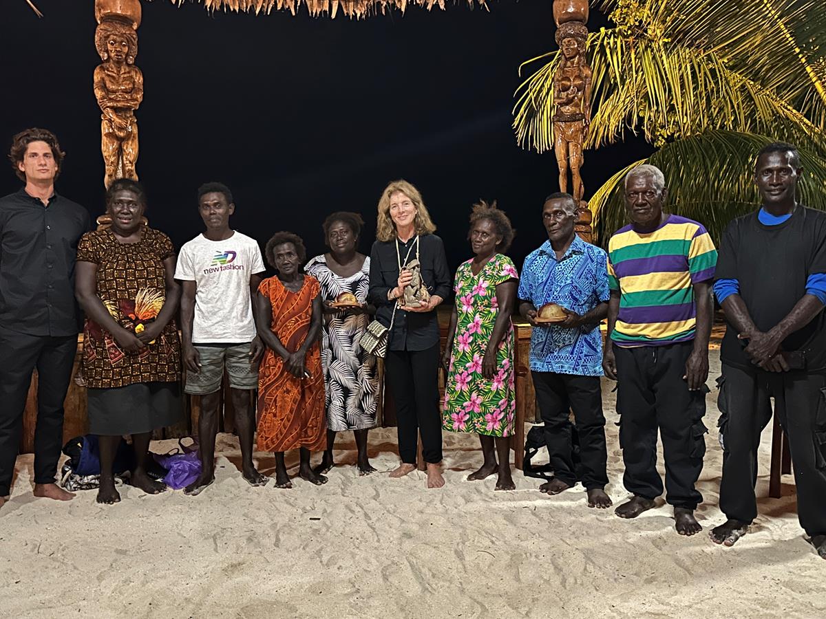 Ambassador Kennedy and her son, Jack Schlossberg, with the families of Biaku Gasa and Eroni Kumana, the two Solomon Scouts who saved President Kennedy's life